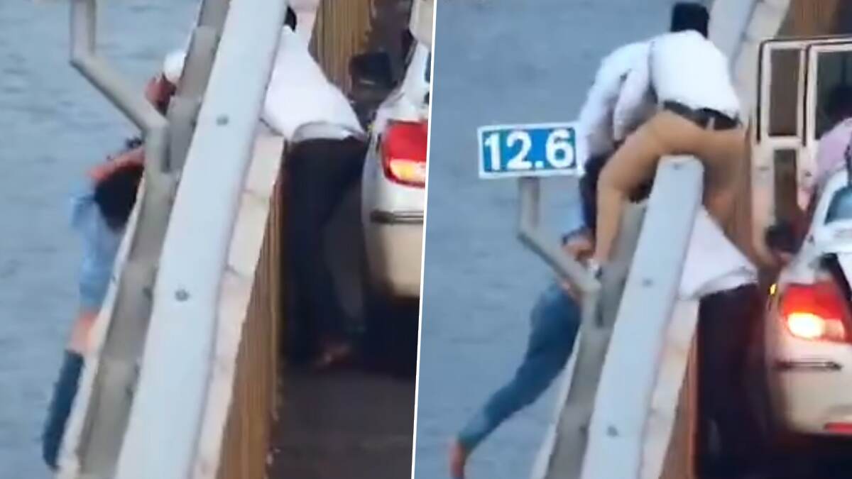 Young Woman Suicide Attempt: பாலத்தில் இருந்து குதித்த இளம்பெண்; தலை முடியை பிடித்து காப்பாற்றிய ஓட்டுநர்.. வீடியோ வைரல்..!