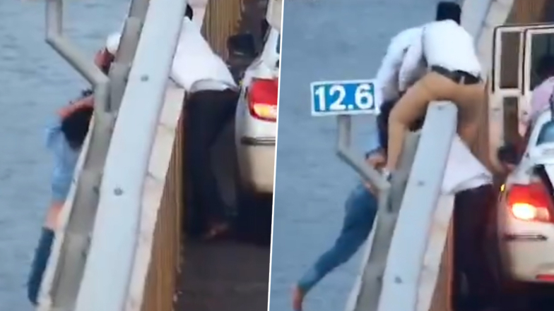 Young Woman Suicide Attempt: பாலத்தில் இருந்து குதித்த இளம்பெண்; தலை முடியை பிடித்து காப்பாற்றிய ஓட்டுநர்.. வீடியோ வைரல்..!